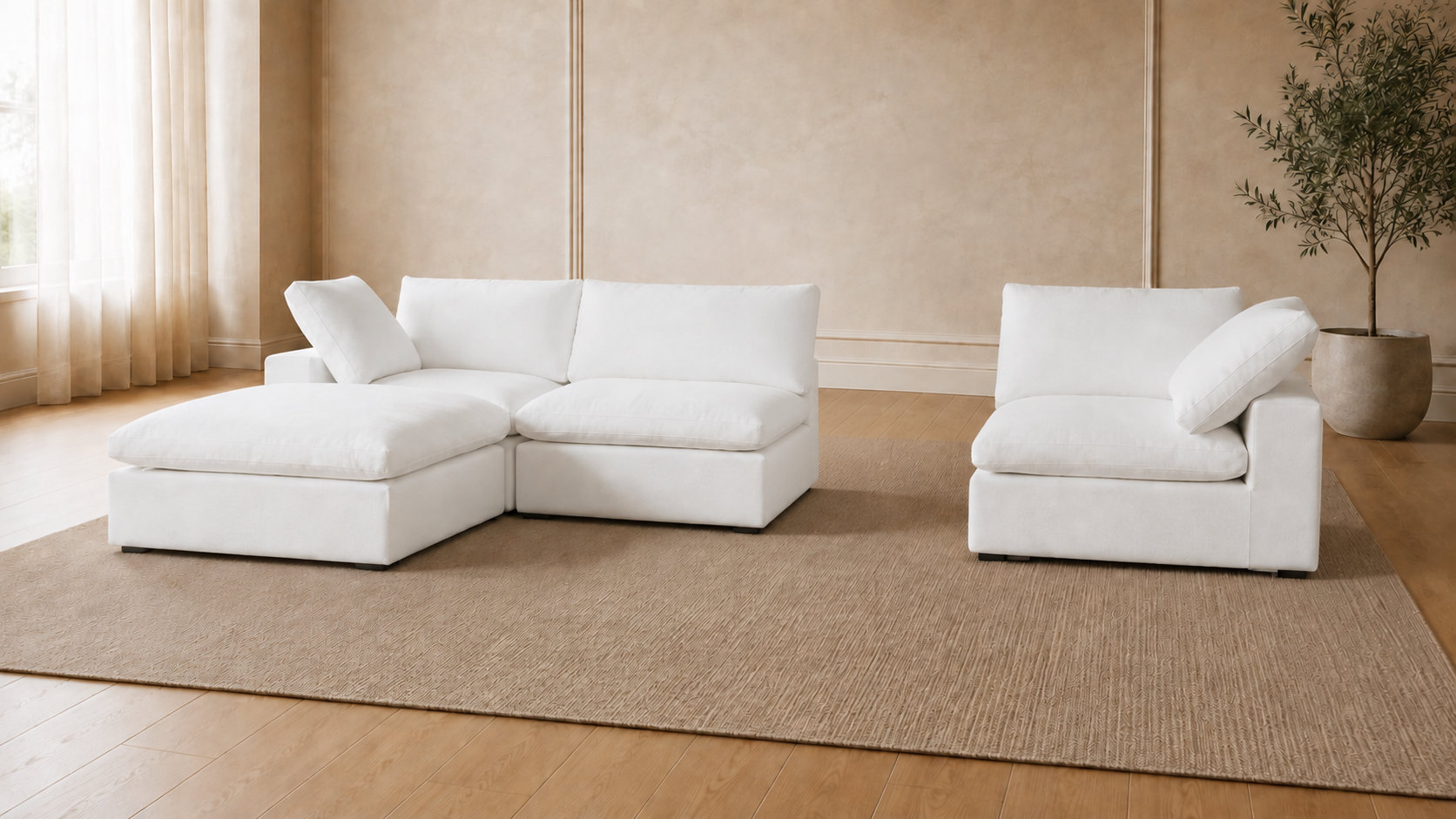 White Ascend modular sectional and armchair arranged in a bright living room